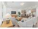 Bright living room showcasing hardwood floors, modern furniture, and an open layout at 1216 Links Crossing Dr # 159, Monroe, NC 28112