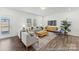Inviting living room with lots of natural light, hardwood floors, and modern furniture at 1216 Links Crossing Dr # 159, Monroe, NC 28112