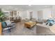 Open-concept living area with hardwood floors, modern decor, and seamless flow to the kitchen at 1216 Links Crossing Dr # 159, Monroe, NC 28112