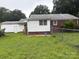 Spacious backyard showcasing green grass, a partial fence, and the rear view of the home at 1292 Longview Rd, Rock Hill, SC 29732
