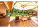 Outdoor patio featuring lounge chairs, a grill, and a pergola overlooking a lush green lawn at 1520 Cureton Dr, Rock Hill, SC 29732