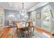 Elegant dining room featuring a chandelier, large windows, and classic decor at 1520 Cureton Dr, Rock Hill, SC 29732