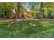 Charming two-story brick home with lush lawn and mature trees at 1520 Cureton Dr, Rock Hill, SC 29732