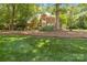 Charming two-story brick home with lush lawn and mature trees at 1520 Cureton Dr, Rock Hill, SC 29732