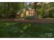 Charming two-story brick home with lush lawn and mature trees at 1520 Cureton Dr, Rock Hill, SC 29732