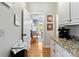 Hallway view leading into a dining space featuring hardwood floors and neutral wall color at 1520 Cureton Dr, Rock Hill, SC 29732
