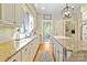 Bright kitchen featuring stone countertops, a central island, and stainless steel appliances at 1520 Cureton Dr, Rock Hill, SC 29732