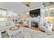 Open-concept living room with fireplace, built-in shelving, and comfortable seating in neutral tones at 1520 Cureton Dr, Rock Hill, SC 29732