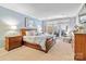Tranquil main bedroom with neutral tones, large bed, and French doors to the outside at 1520 Cureton Dr, Rock Hill, SC 29732