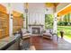 Outdoor space featuring a fireplace with chairs, a ceiling and wooden beams at 1520 Cureton Dr, Rock Hill, SC 29732