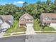 A high angle of the front of the home, manicured lawns, and street at 15203 Oldcorn Ln, Charlotte, NC 28262