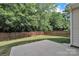 Private backyard featuring a wooden fence and lots of green space, creating a serene outdoor oasis at 15203 Oldcorn Ln, Charlotte, NC 28262