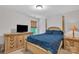 Comfortable bedroom includes light-colored walls, a ceiling fan, and a window to let in natural light at 15203 Oldcorn Ln, Charlotte, NC 28262
