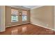 Bright bedroom with hardwood floors and large windows offering ample natural light at 15203 Oldcorn Ln, Charlotte, NC 28262
