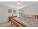 Cozy bedroom with a large window offering natural light, and ample dresser space at 15203 Oldcorn Ln, Charlotte, NC 28262