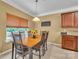 Bright dining area featuring natural light, table with seating, and bar area at 15203 Oldcorn Ln, Charlotte, NC 28262