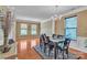 Elegant dining room features hardwood floors, decorative columns, and a chandelier at 15203 Oldcorn Ln, Charlotte, NC 28262