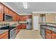 Spacious kitchen with stainless steel appliances, granite countertops, and ample cabinetry at 15203 Oldcorn Ln, Charlotte, NC 28262