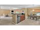 Cozy living room area with granite countertops, stainless steel dishwasher, and dining table at 15203 Oldcorn Ln, Charlotte, NC 28262