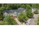 Overhead view of well-maintained townhomes surrounded by lush greenery, offering a peaceful community setting at 15432 Coventry Court Ln, Charlotte, NC 28277