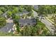 Aerial shot of a group of townhomes with backyard patios and lush greenery in a suburban setting at 15432 Coventry Court Ln, Charlotte, NC 28277
