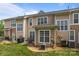 Backyard patio features outdoor seating, a grill, and lush green grass at 15432 Coventry Court Ln, Charlotte, NC 28277