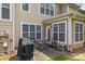Backyard patio area with grill and table, perfect for outdoor entertaining at 15432 Coventry Court Ln, Charlotte, NC 28277