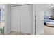 Bedroom closet with bi-fold doors, and access to primary bedroom at 15432 Coventry Court Ln, Charlotte, NC 28277