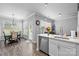 Open concept kitchen and dining area with hardwood floors and lots of natural light at 15432 Coventry Court Ln, Charlotte, NC 28277