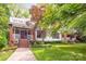 Beautiful two-story home with a well-manicured lawn, covered porch, and upper-level deck; an ideal home at 1801 E 8Th St, Charlotte, NC 28204
