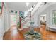 Elegant foyer featuring a staircase with painted mural and hardwood floors leading to various rooms at 1801 E 8Th St, Charlotte, NC 28204
