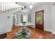 Bright foyer with hardwood floors, staircase, and decorative table near the wooden front door at 1801 E 8Th St, Charlotte, NC 28204