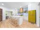 Bright kitchen with white island, wooden stools, and retro appliances, with backyard view at 1801 E 8Th St, Charlotte, NC 28204