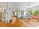 Inviting living room featuring hardwood floors, bright windows, and access to other rooms in the home at 1801 E 8Th St, Charlotte, NC 28204