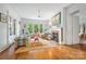 Comfortable living room featuring hardwood floors, fireplace, and bright windows overlooking greenery at 1801 E 8Th St, Charlotte, NC 28204