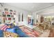 Charming living room with hardwood floors, comfortable furniture, and stylish shelving at 1801 E 8Th St, Charlotte, NC 28204