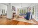 Bright living room with hardwood floors, a brick fireplace, and large windows providing ample natural light at 1801 E 8Th St, Charlotte, NC 28204