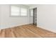 Bedroom featuring a window, closet, and hardwood floors at 1831 Erie St, Charlotte, NC 28216