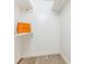 Walk in closet with shelves and hardwood floors at 1831 Erie St, Charlotte, NC 28216