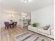 Open-concept living space with dining area, kitchen, and comfortable seating area at 1831 Erie St, Charlotte, NC 28216