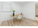 Bright office space featuring modern flooring, white walls, and a simple desk setup at 1831 Erie St, Charlotte, NC 28216