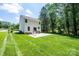Spacious backyard showcasing a large patio ideal for entertaining, surrounded by lush greenery and mature trees at 2045 13Th Ne St # 3, Hickory, NC 28601