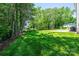 The backyard shows a well-manicured lawn and mature trees at 2045 13Th Ne St # 3, Hickory, NC 28601