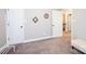 A bedroom with two entry doors, neutral walls, and carpeted flooring offers versatility at 2045 13Th Ne St # 3, Hickory, NC 28601