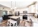 Stylish kitchen featuring stainless steel appliances, a center island with seating, and an open layout connecting to the living room at 2045 13Th Ne St # 3, Hickory, NC 28601