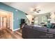 Spacious living room featuring hardwood flooring, a comfortable sofa, a ceiling fan, and access to other areas of the home at 2045 13Th Ne St # 3, Hickory, NC 28601