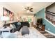 Open-concept living room features hardwood flooring, a large sectional sofa, and seamless access to the kitchen and staircase at 2045 13Th Ne St # 3, Hickory, NC 28601