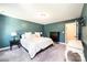 Comfortable main bedroom with calm blue walls, plush carpet, and decorative accents for a relaxing space at 2045 13Th Ne St # 3, Hickory, NC 28601