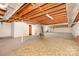 Spacious unfinished basement with exposed beams and concrete floor at 215 Jan Mar Dr, China Grove, NC 28023