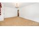 Spacious bedroom with carpet and traditional chandelier at 215 Jan Mar Dr, China Grove, NC 28023